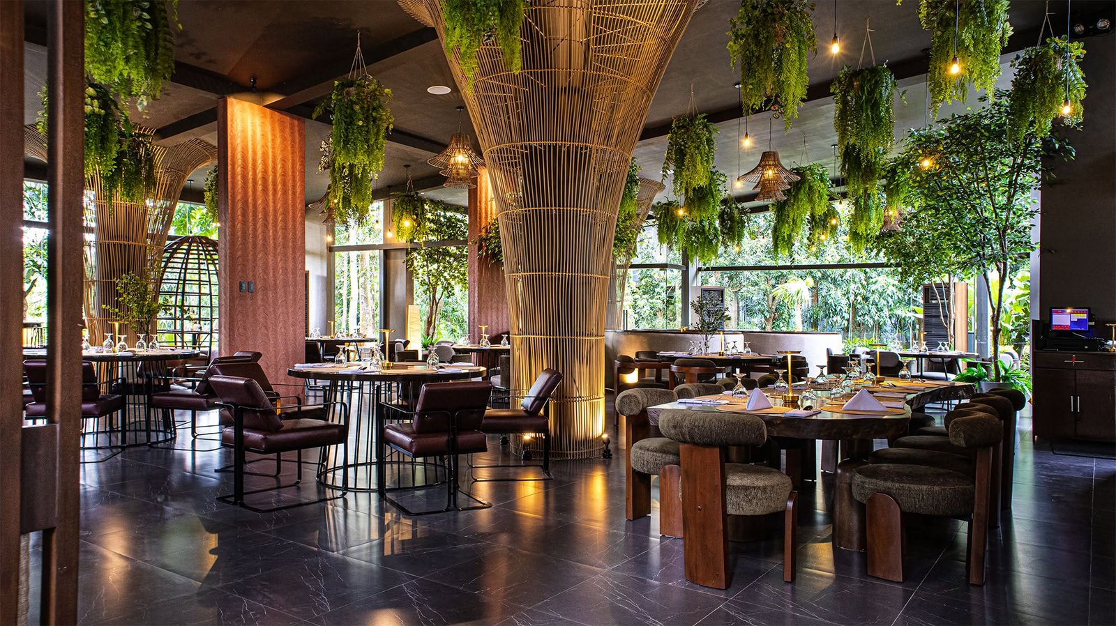 Restaurant interior with a large woven bamboo column and warm lighting